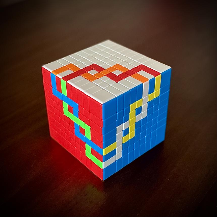 photo of a 9x9x9 rubik's cube solved to depict a mathematical knot, the (9,2)-torus knot